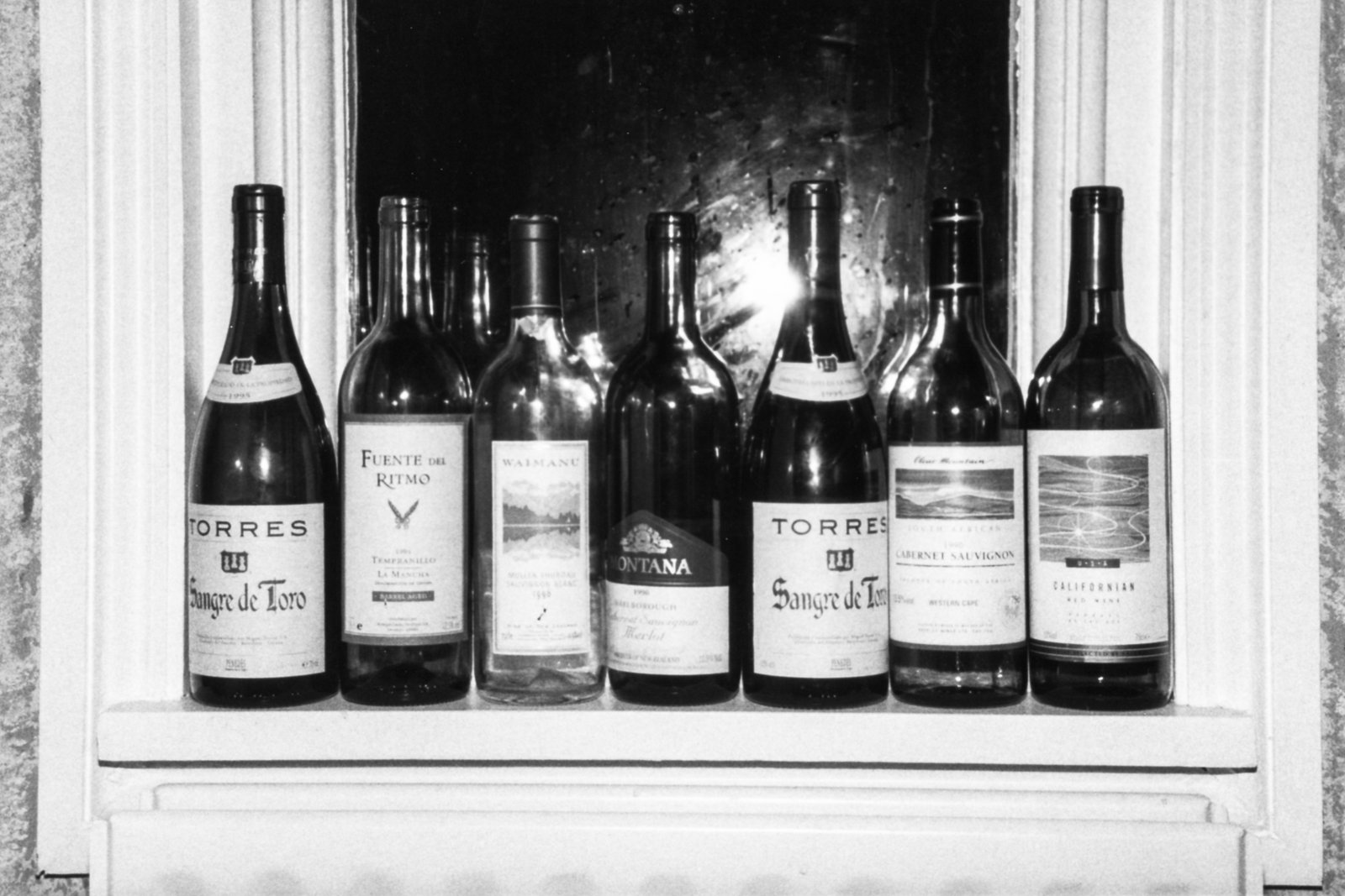 Photo showing a wine collection (8 bottles) drunk by Chris, Clare and James while recording song titled Seems to Me